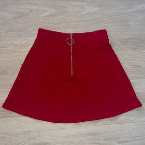 Red skater style skirt with functional zipper detail